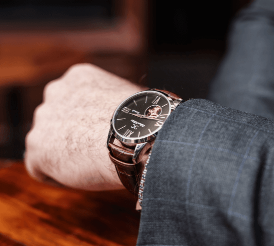 Luxury automatic watch worn on wrist with casual attire